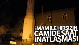 İmamla inatlaşan hırsız kafaya koyduğu saati çaldı
