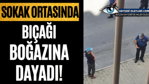 Sokak ortasında boynuna bıçak dayadı.